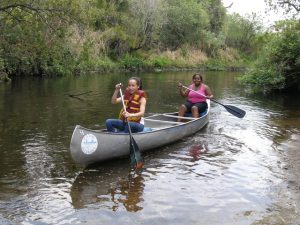 two students in a canoe.