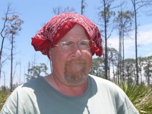 Man wearing a bandana as sun protection.