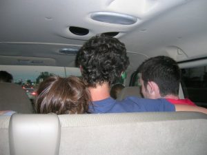 Back of students heads in a van.