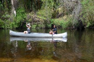 Two women in a canoe.